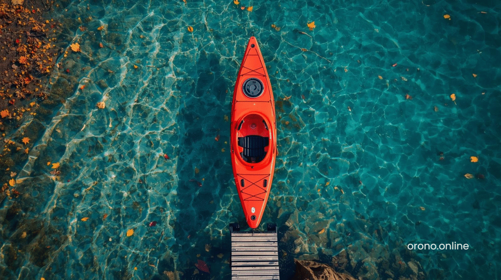 Red kayak launch at Minnesota lake access point with clear shallow water and autumn leaves