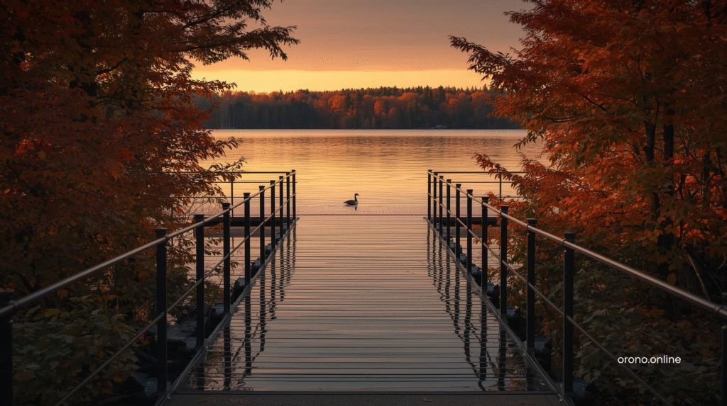 North Arm Launch boat ramp reflecting autumn maple trees in still Lake Minnetonka at golden hour